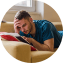A man holds his head as he worries about finances